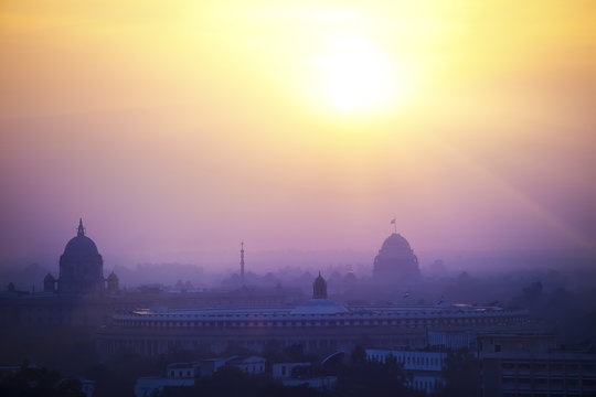 India. A silhouette of temples and buildings of Delhi in a sunset haze