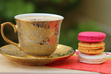 A cup of coffee with sesame cake
