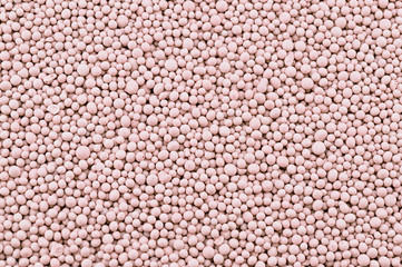 Pink composite mineral fertilizers. Background