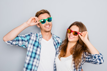 Obraz premium Portrait of happy smiling couple in love wearing colored spectac