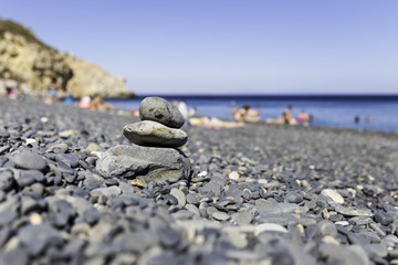 Stack of zen spa stones on Mavra Volia volcano gravel beach in Chios
