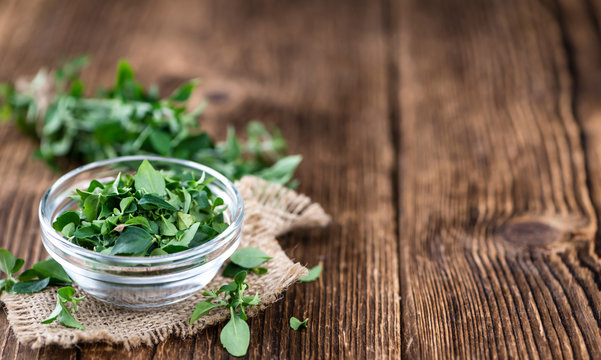 Wooden Table with fresh Menthol leaves