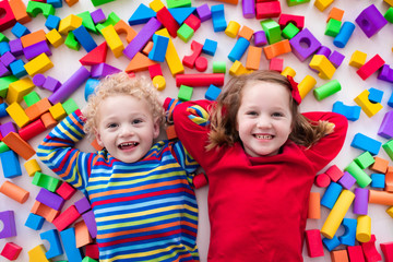 Children playing with colorful blocks.