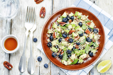 Quinoa avocado blueberry pecan salad with maple syrup lime dress
