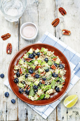 Quinoa avocado blueberry pecan salad with maple syrup lime dress