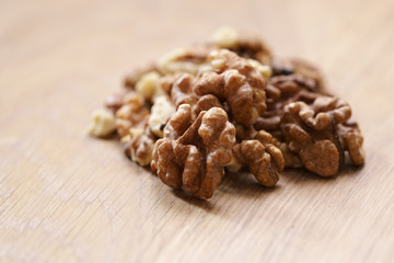 walnut kernels on aok wood table close up