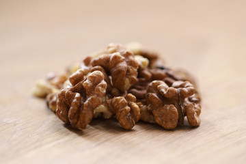 walnut kernels on aok wood table close up
