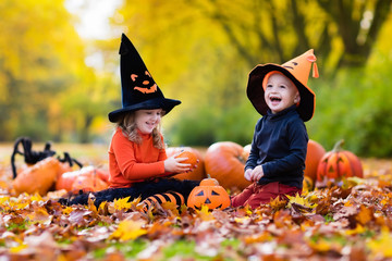Kids with pumpkins on Halloween