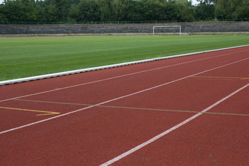 Running track and football pitch on a old athletic stadium