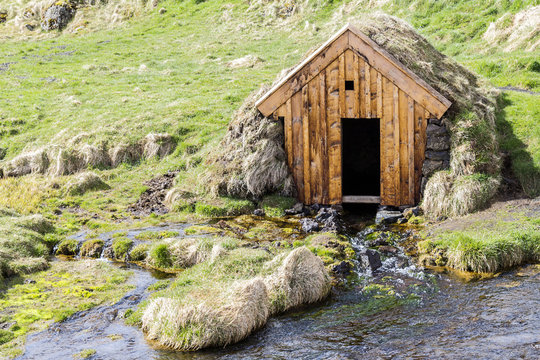 Wooden hut in the birth of a river. Iceland.