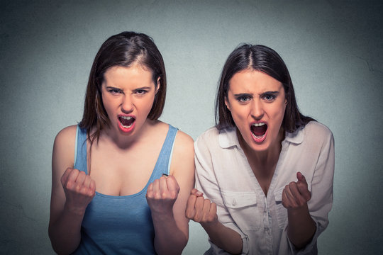 Two beautiful angry women screaming