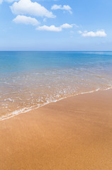 white soft wave on  tropical beach in sunny day