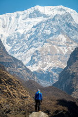 Fototapeta na wymiar The man standing in front of The Annapurna south face of Himalaya mountains range.