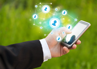 Finger pointing on smartphone, social network concept