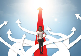 businesswoman with different direction arrows