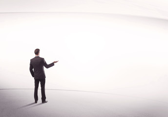 Obraz premium Businessman with briefcase standing still