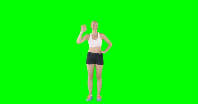 Woman making a hand gesture with green screen