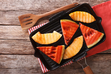 Ripe Healthy organic Grilled watermelon and melon. Horizontal top view
