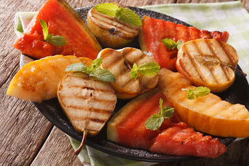 Watermelon, pear, apple and melon grilled close-up. horizontal
