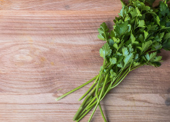 Fresh parsley herbs on wooden chopping board