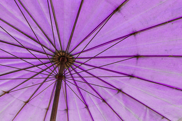 The bottom to top view of pink umbrella