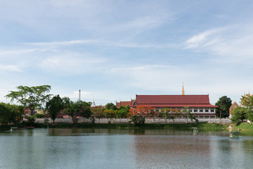 The thai temple near lake with blue sky