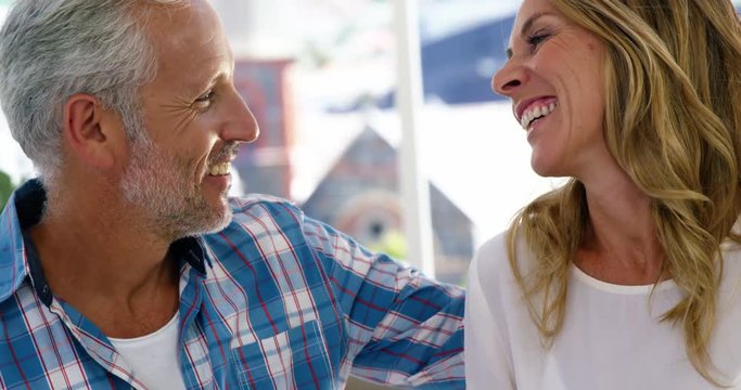Mature couple is laughing together at home 