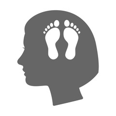 Isolated female head silhouette icon with two footprints
