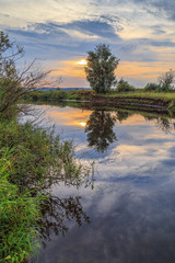 Sunset over small river in central Russia