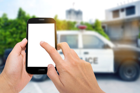 Smartphone with police car on the road background