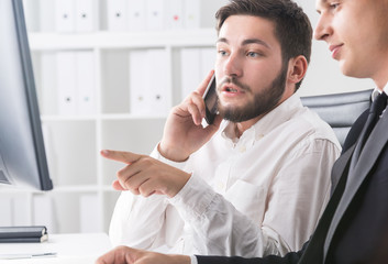 Colleagues working with database