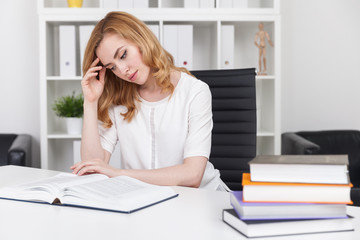 Woman reading in office