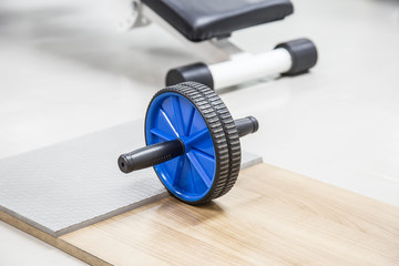 abs training roller,ab wheel in fitness gym.