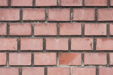 Obraz premium Old red brick wall background macro, selective focus.