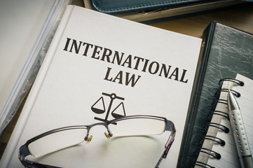 International law book. Justice and legislation concept.