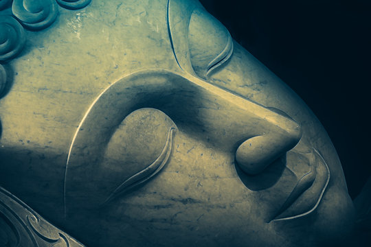 Close up beautiful sleeping Buddha face with painting art effect.