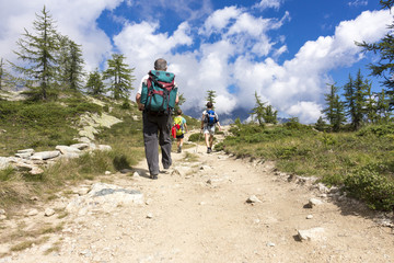 people walking on a mountain trail