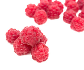 Ripe raspberry on a white background