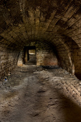 Old abandoned tunnel in the underground wine cellar. Entrance to