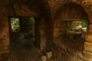 Old abandoned tunnel in the underground wine cellar. Entrance to