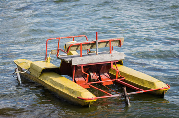 Old and dirty waterbike stay in the water.