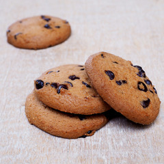 Close up of stack of Milk Chocolate Chip Cookies on a wooden tab