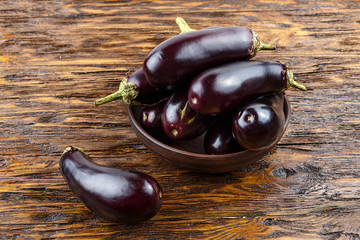 harvest of eggplant on a wooden table