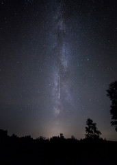 Shooting star and Milk Way. Perseid meteor shower night sky.