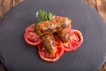 grilled sausages with tomato