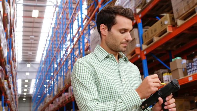 Warehouse worker doing inventory 