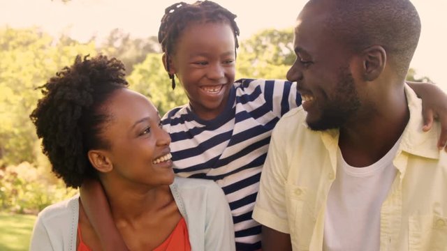Portrait of happy family at park