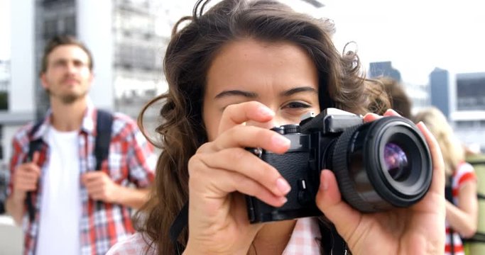Beautiful woman taking pictures 