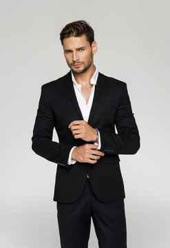 Portrait of handsome man in black suit