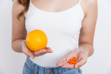 Girl with orange and medicine